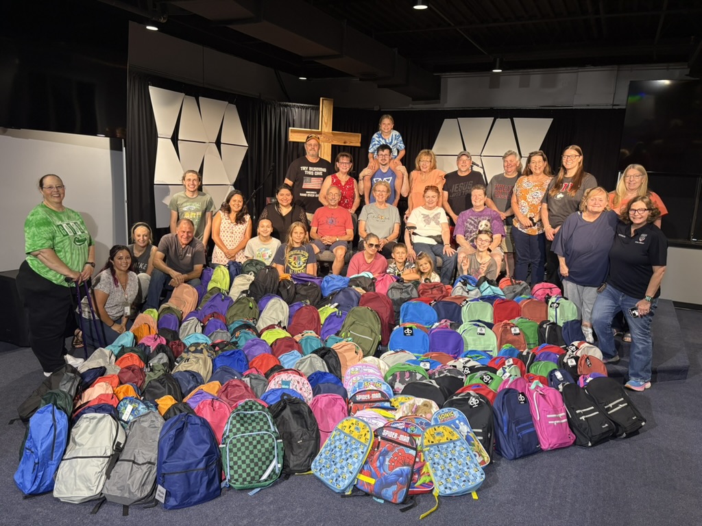 Anchor Point church family gathered together after a community backpack drive